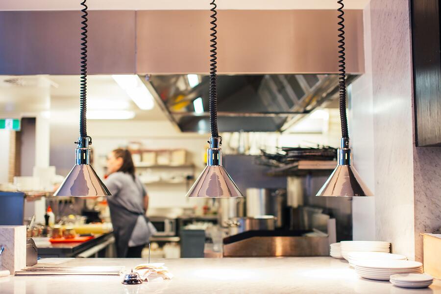 Stainless steel equipment along a restaurant kitchen line