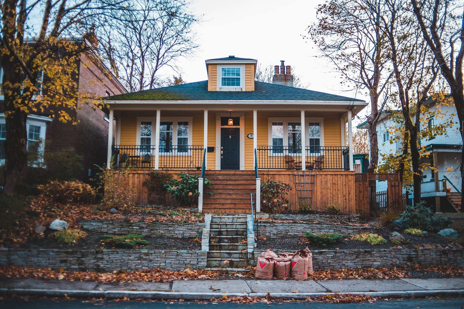A Craftsman bungalow with a deep front porch and tapered columns